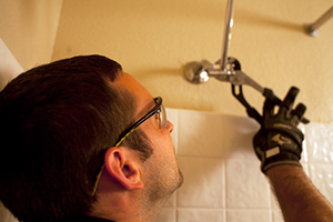 Liam is working on a shower head repair